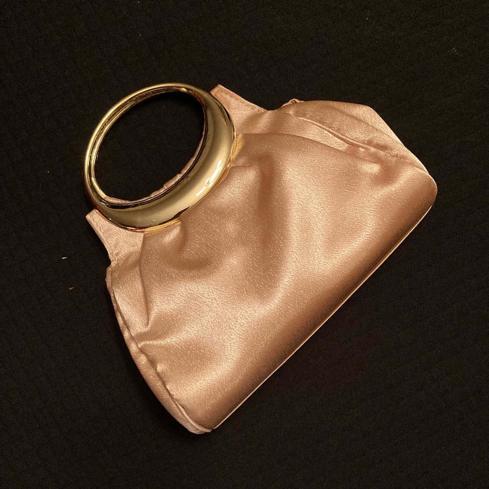 Clutch purse with shoulder strap option.